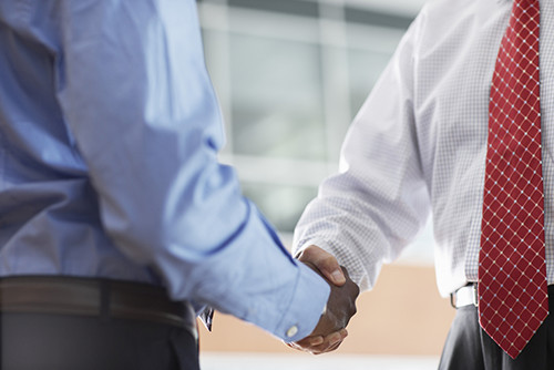 Two business  men shaking hands